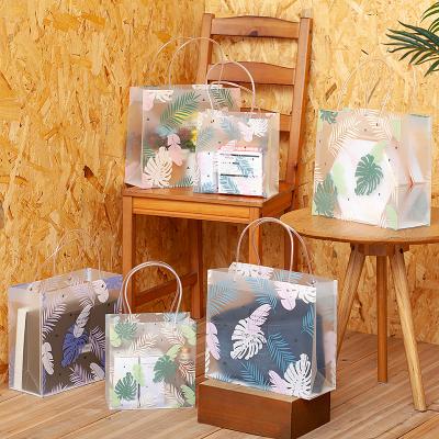 China Recycled Materials Wholesale Custom Printed Luxury Gift Shopping Bag With Transparent Handle Bag For Cloth Cosmetic Book for sale