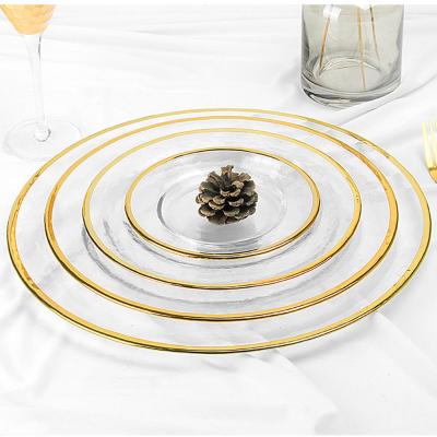 China Sustainable Wholesale Clear Glass Charger Dishes With Gold Rim for sale