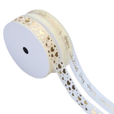 China Custom Polyester Christmas Gold Wrapping Ribbon Riased Embossed Printed Rolls for sale