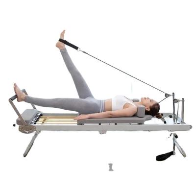 China Durable Premium White Aluminium Reformer Pilates Core Bed Metal Foldable Pilates Equipment Reformers Machine For Sale for sale