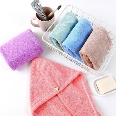 China Viable Wholesale Water Absorbing Soft Thick High Density Coral Fleece Triangle Hair Dry Turban Shower Hats For Women for sale