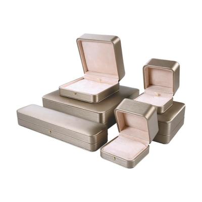 China Packaging Jewelry Display Customized Design Gold PU Leather Valentines Packaging Jewelry Box Ring Necklace Earring Bracelet Jewelery Boxes With Logo for sale