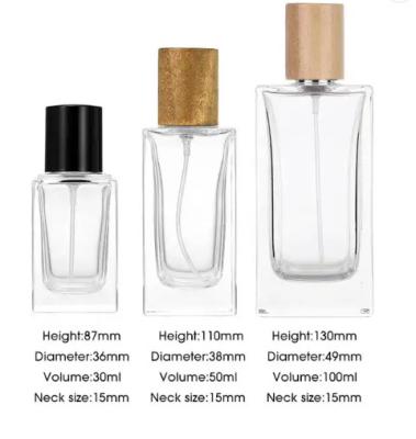 China 30ml 50ml 100ml Clear Glass Thick Wall Flat Shoulder Rectangle Square Perfume Bottles Empty with Mist Spray Wooden Cap O for sale