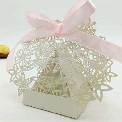 China New Design Recyclable Creamy Flower Laser Cut Paper Wedding Candy Box Chocolate Favor Box Baby Shower Gift Box With Ribbon for sale