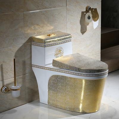 China Cuarto de baño de lujo dorado de una sola pieza inodoro de cerámica sanitarios en venta