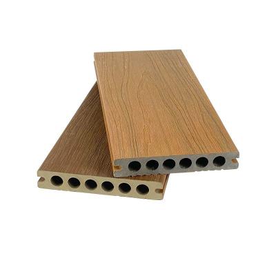 China Co-Raad van Uitdrijvings de Houten Plastic Samengestelde Decking buiten Bevloering 138x23mm Ronde Gatenhdpe Te koop