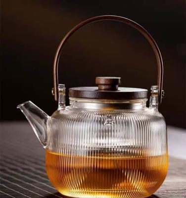 China Sustainable Home Transparent Heat Resistant Glass Teapot With Plastic Handle for sale