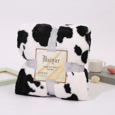 China Folded Double Layer High Quality Flannel Plush Throw Super Soft Cow Print Winter Fleece Baby Kids Blankets Blanket for sale