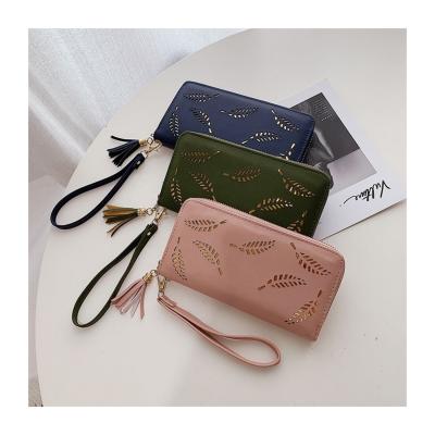 China Fashionable Luxury Ladies Long Clutch Purse Hollowing Out Leather Zipper Women Card Wallet for sale