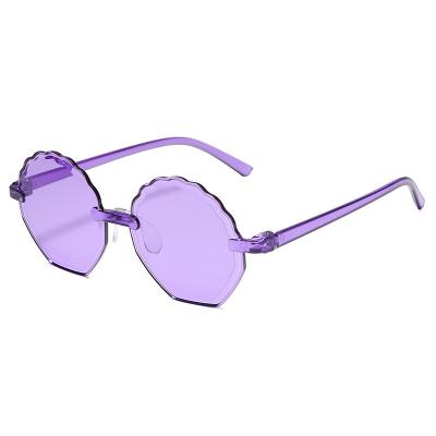 China 2021 Girls Cat Eye Kids Boy Sunglasses Candy Color Newest Fashion Sunglasses Rimless Transparent Manufacture For Sun UV Lenses Custom Made for sale