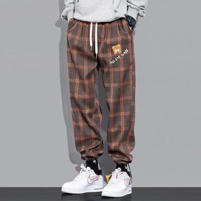 China Breathable Wholesale Casual Wide Leg Streetwear Pants Fringe Plaid Pants Sweatpants for sale