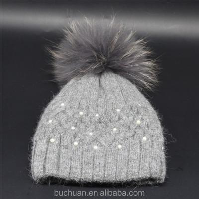 China COMMON Light Gray Knitted Beanie Hat with Matching Color Raccoon Fur Pom for sale