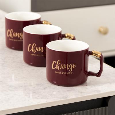 China Viable Wholesale Hot Sale Home Ceramic Coffee Cups Set Beverage Mugs Irregular Gold Handle Ceramic Coffee Cup and Saucer Sets for sale