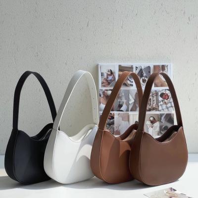 China 2022 new fashionable niche design PU PORTABLE shoulder bags and armpit bags of popular simple handbags for sale