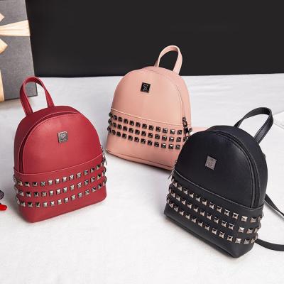 China Rivet Small Backpack New PORTABLE Japanese Oblique Personality Mini Purse Mini Pu Phone Bag Backpack for sale