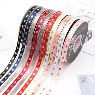 China 2021 New Arrival 100% Polyester Holographic 10mm Satin Valentine Flower Decorative Wrapping Ribbon Printed Heart Valentine Ribbon for sale