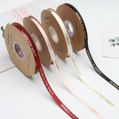 China 10mm Holographic Tan LOVE IS ETERNAL Ribbon Butterfly and Flower Valentine's Day DIY Gift Wrap Hair Accessories Satin Ribbon Roll for sale