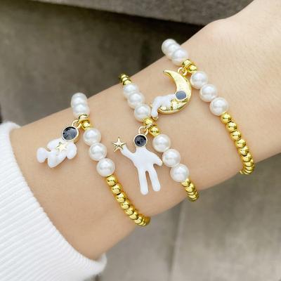 China Chosen Jewelry RTS Fashion Design Brass Gold Plated Moon Star Bead Enamel Astronaut Beaded Elastic Bracelet For Gift Jewelry for sale