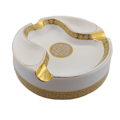 China Best Selling Custom Fasion Design Nice Unique Round Ceramic Cigar Ashtray With Custom Logo With Gold Rest for sale