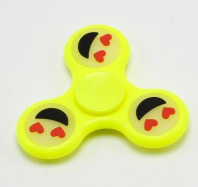 China Hand Toy Glow In The Dark Face Hand Spinner Wiggle Person Smile Toys For Kids for sale