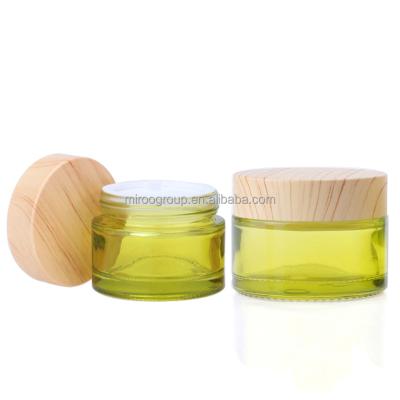 China Wholesale 30g 50g Luxury Light Green Cosmetic Glass Beauty Creams Packagng Jar With Bamboo Looks Lids for sale