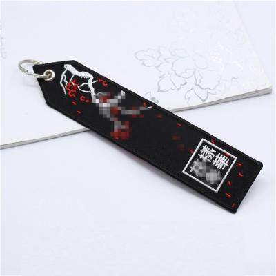 China Promotion Gift No Logo Fabric Woven Logo Key Chain Min Custom Embroidered Spray Tag for sale