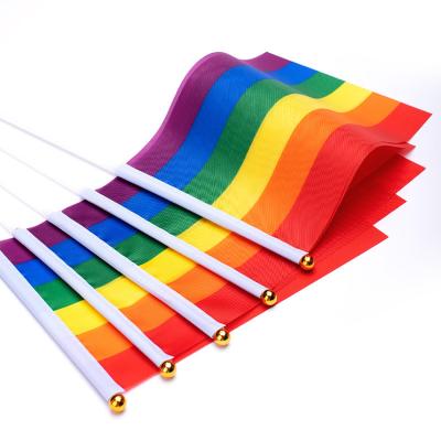 China Wholesale Lgbt Symbols Rainbow FLYING Hand Waving Waving Flag With Wooden Stick for sale