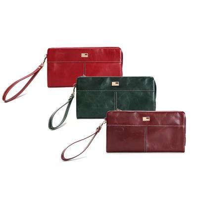 China Hot Sale Anti-theft Women's Clutch Wallet Women's Purse With Long Strap Zipper Mobile Phone Top Layer Oil Wax Leather Fashion Wallet for sale