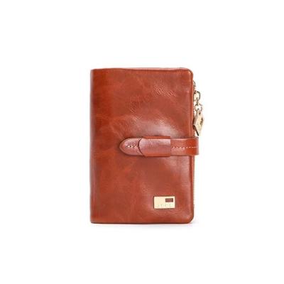 China Luxury Short Wallet Women's Top Layer Oil Wax Leather Triple Red Leather Wallet for sale