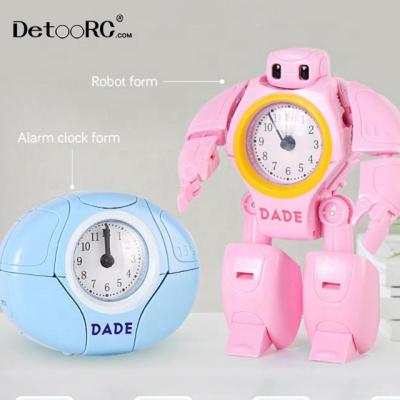 China Toy Detoo Battery Operated 2 In 1 Deformation Robot Alarm Clock Children Toys Multi Functional Creative Toys for sale