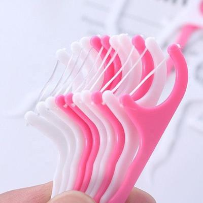 China 30pcs/Lot Flosser Brush Disposable Dental Interdental Teeth Stick Toothpicks Floss Pick Oral Gum Teeth Cleaning Care HF501 for sale