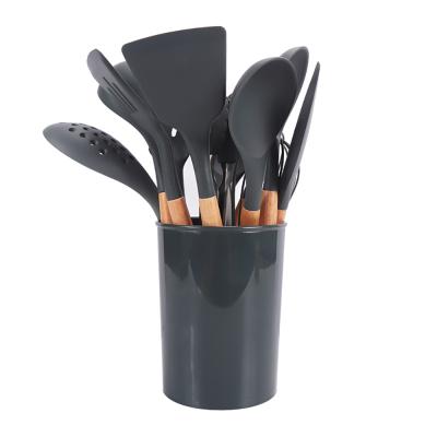 China Amazon Viable Hot Selling 13pcs Silicone Kitchenware Cooking Silicone Cooking Utensils Set With Wooden Handle for sale