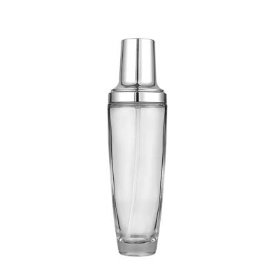 China Berlin Packaging Glass Silver Cosmetic Bottle with Lotion Pump Flint Round 30ml 60ml Perfume Spray Empty Glass Bottle for sale