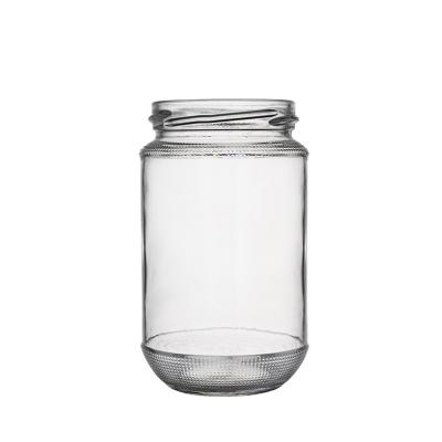 China Food Berlin Packaging Round Glass Storage Jar 16oz Food Grade Transparent General Purpose Glass Honey Jar Round With Pattern for sale