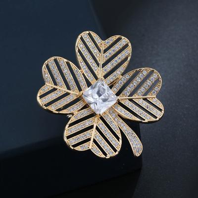 China Fashion hot copper material micro copper inlaid zircon brooch four leaf flower temperament soft women's clothing accessories for sale