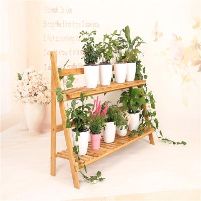 China Morden Luxury Professional Manufacture Cheap Two Layers Bamboo Foldable Flower Shelf for sale