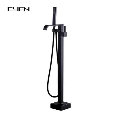 China CYEN Matte Black Freestanding Bathtub Faucet Lead Free Solid Brass Tub Floor Mount Waterfall Tub Filler Faucet With Hand Shower for sale