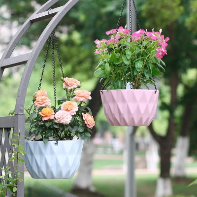 China Modern Convenience Basket Flower Pots And Planters Resin Self-absorbing Greenery Hanging Plastic Pot for sale