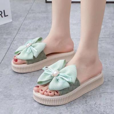 China Fashion Trend New summer muffin bottom slippers women wear bow thick bottom anti-slip wear women's slippers for sale