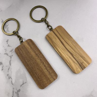 China Engravable Handcrafted Wooden Key Chain Blank Keychains Wooden Craft Father's Day Gift for sale