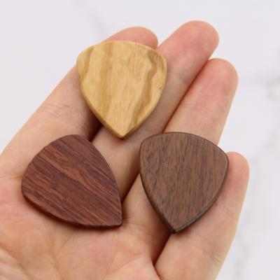 China Custom Crafts Quality Guitar Pick White Engravable Wooden Guitar Pick Personalized Gift for sale