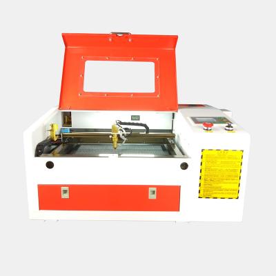 China Chinese Mini 40w 50w 60w CO2 Laser Engraving Machine Wooden MDF Laser Engraver Cutter 4030 for sale