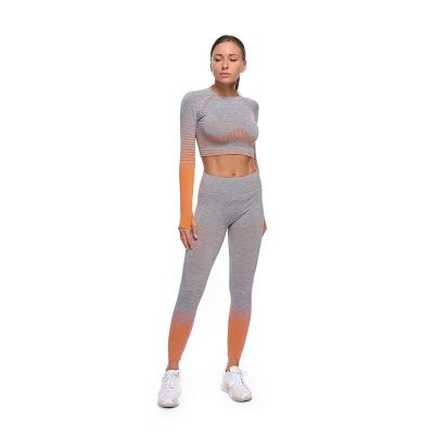 China New European and American Seamless Yoga Suit QUICK DRY Knitted Frontier Yoga Sports Fitness Stretch Hip Short Sleeve Lifting Suit for sale