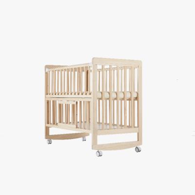 China Multifunctional Solid Wood Side Bed OEM Baby Hutch With Wheels Storage Drawer Baby Crib for sale