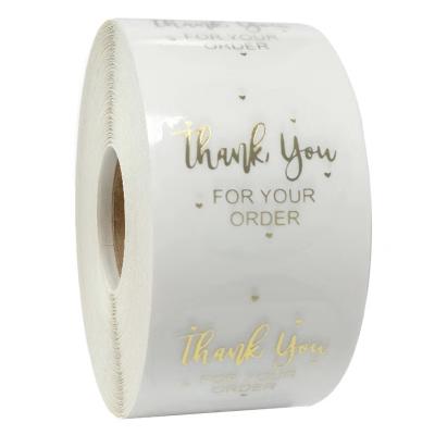 China Clear Waterproof Custom Gold Foil Self Adhesive Logo Printing Roll Transparent Labels Sticker Printing for sale