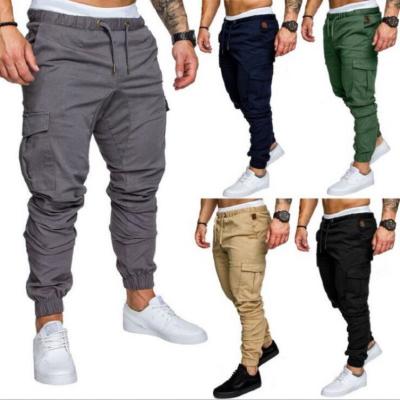 China new Anti-wrinkle style solid color pocket cargo sweatpants men's jogger sweatpants men's multi drawstring pants for sale