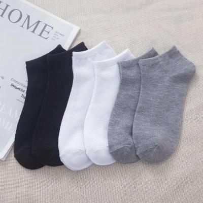 China XINQI OEM/ODM Solid Color Men's and Women's Solid Color Breathable Low Cut Socks 144N Wholesale Black and White Invisible Sock for sale