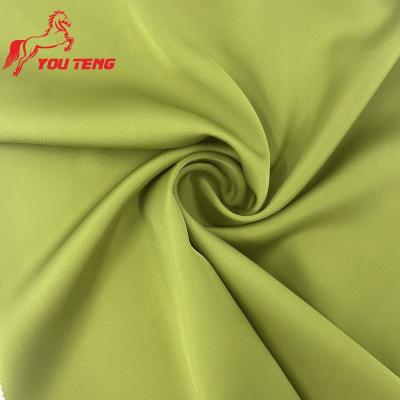 China Flame Retardant 140GSM Crease Resist Imitation Acetate Fabric Smooth Delicate Silky Polyester Fabric 100% Shiny Satin For Premium Shirt Blouse for sale