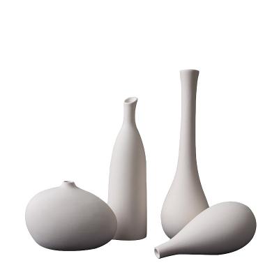 China Creative Ceramic Home Decor Minimalist Nordic Ornament Instagram Style White Plain Vase Flower DIY Props Shooting Ceramic Vase for sale