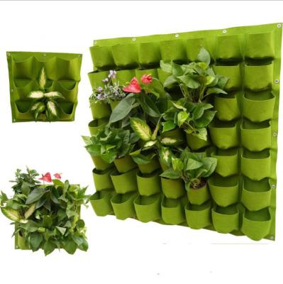 China Economical 49 Pocket Vertical Wall Hanging Felt To Grow Bag Greenhouse Vegetable Garden Planting Bags for sale